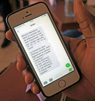 The practice tests on a student's phone. This shows an introduction message with instructions sent at the beginning of each week, a multiple-choice question, and a student reply with their answer choice. A feedback message would be sent the following day providing the correct answer.