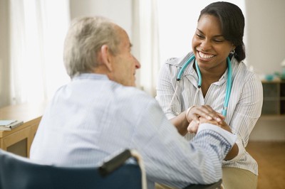 A home care worker checks in on a patient.  Image by Myfuture.com, licensed via CC BY-ND 2.0.