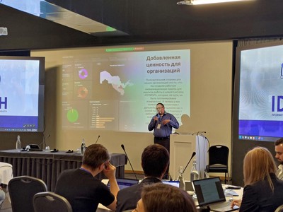 The Uzbekistan country team presents on the impact of their team project.